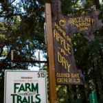 Wooden sign and Farm Trails marker